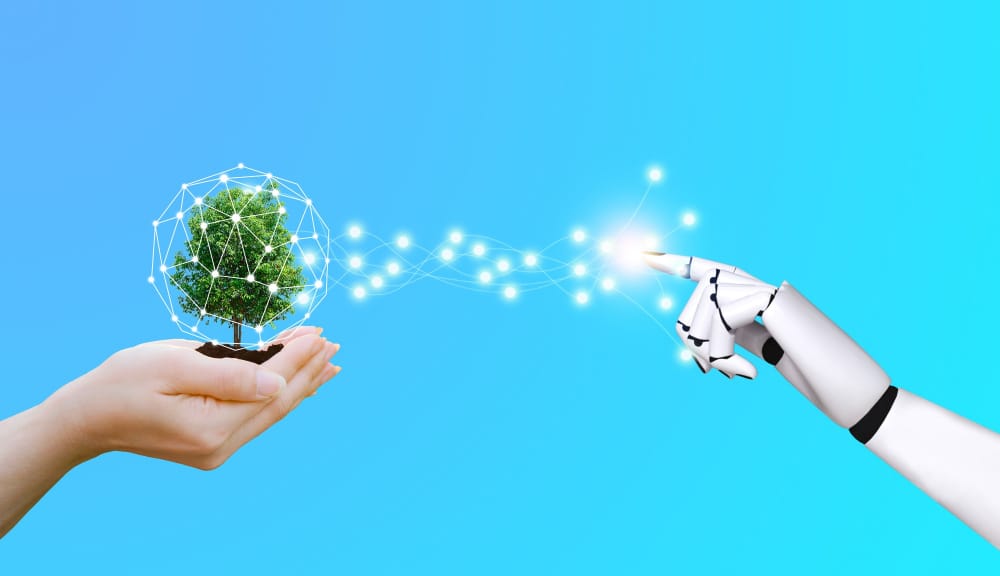 albero nelle mani robotiche di ecologia e tecnologia della mano umana
