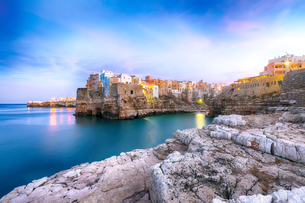 tramonto al golfo di cala paura a polignano a mare