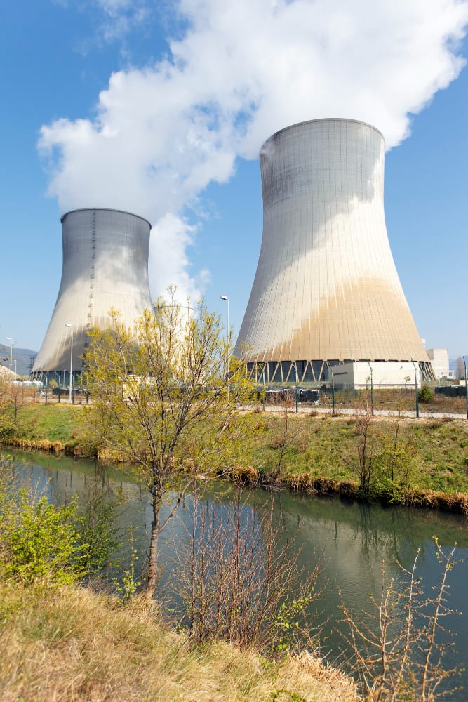 smokestacks nuclear factory river summer