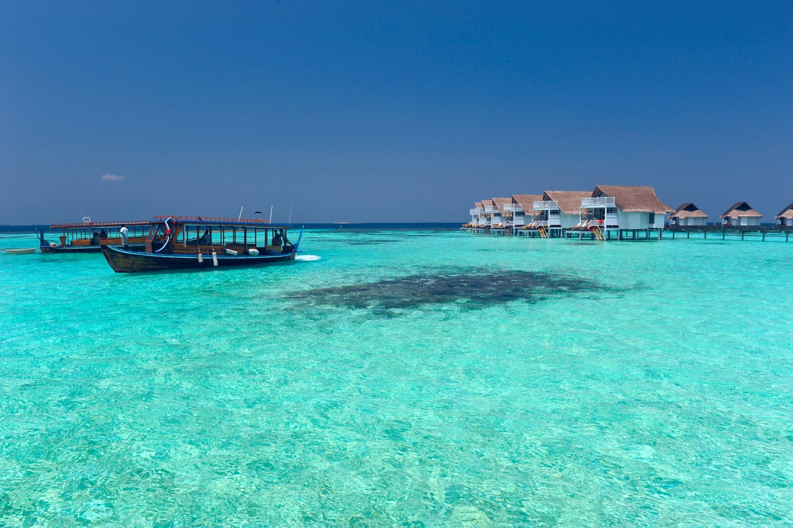 Maldive, paradiso tropicale, ideale per immersioni e snorkeling tra atolli e barriere coralline